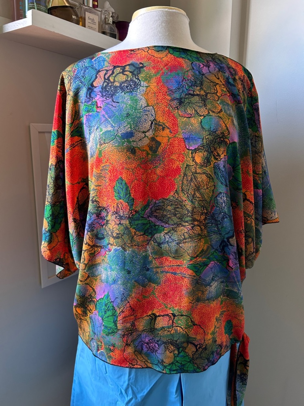 Multicolored floral print dolman sleeve blouse with tie on the side